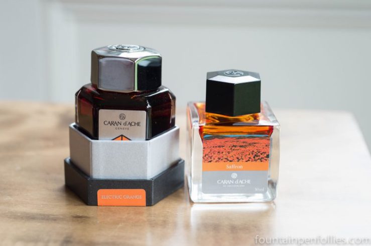 Caran d'Ache Electric Orange and Caran d'Ache Saffron ink bottles